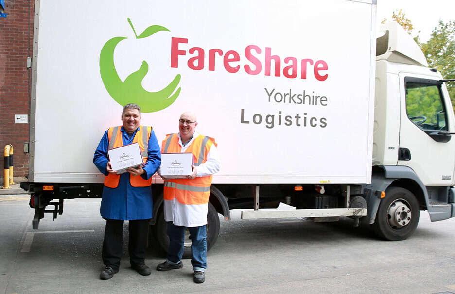 Two FareShare employees stood in front of Lorry